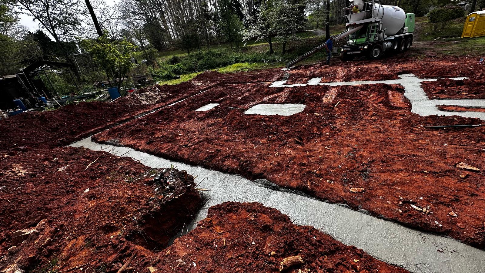 Concrete foundation pour with mixer truck on residential site
